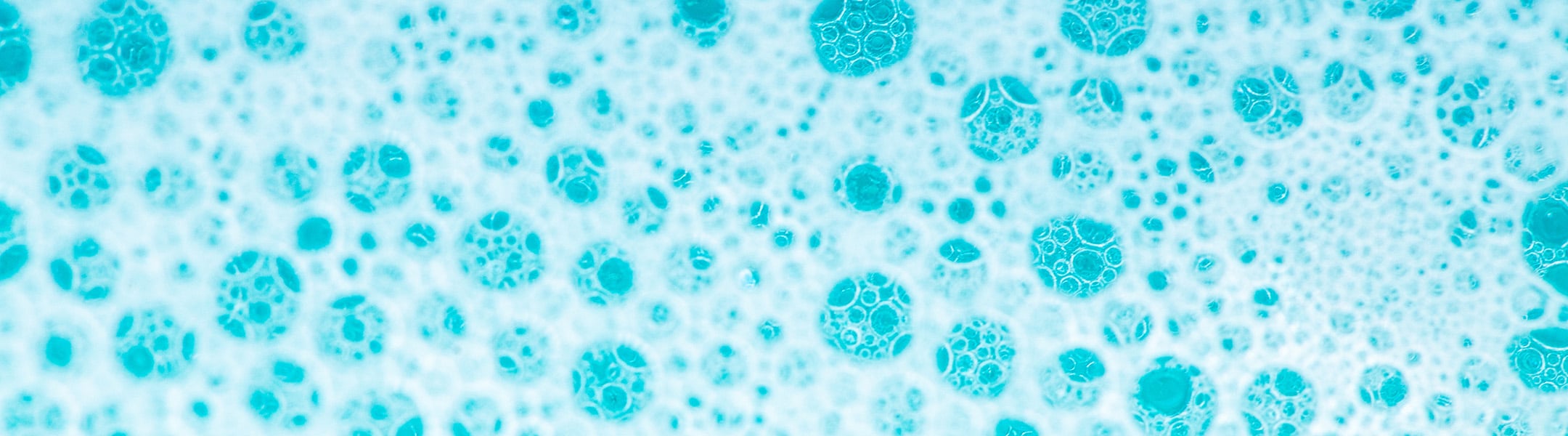 Water With White Foam Bubbles.cleanliness And Hygiene Background